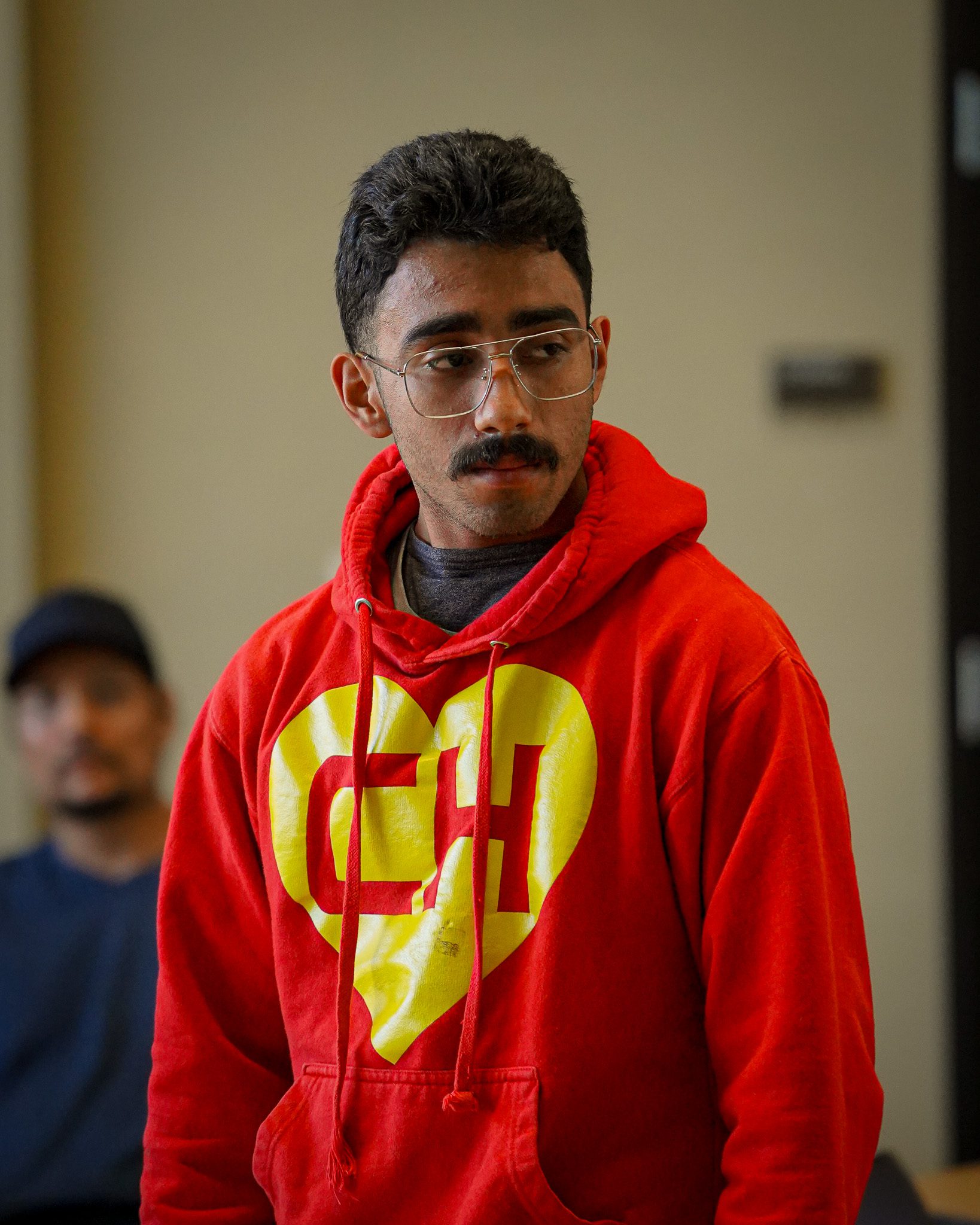 young man in a hoodie at a healing justice session