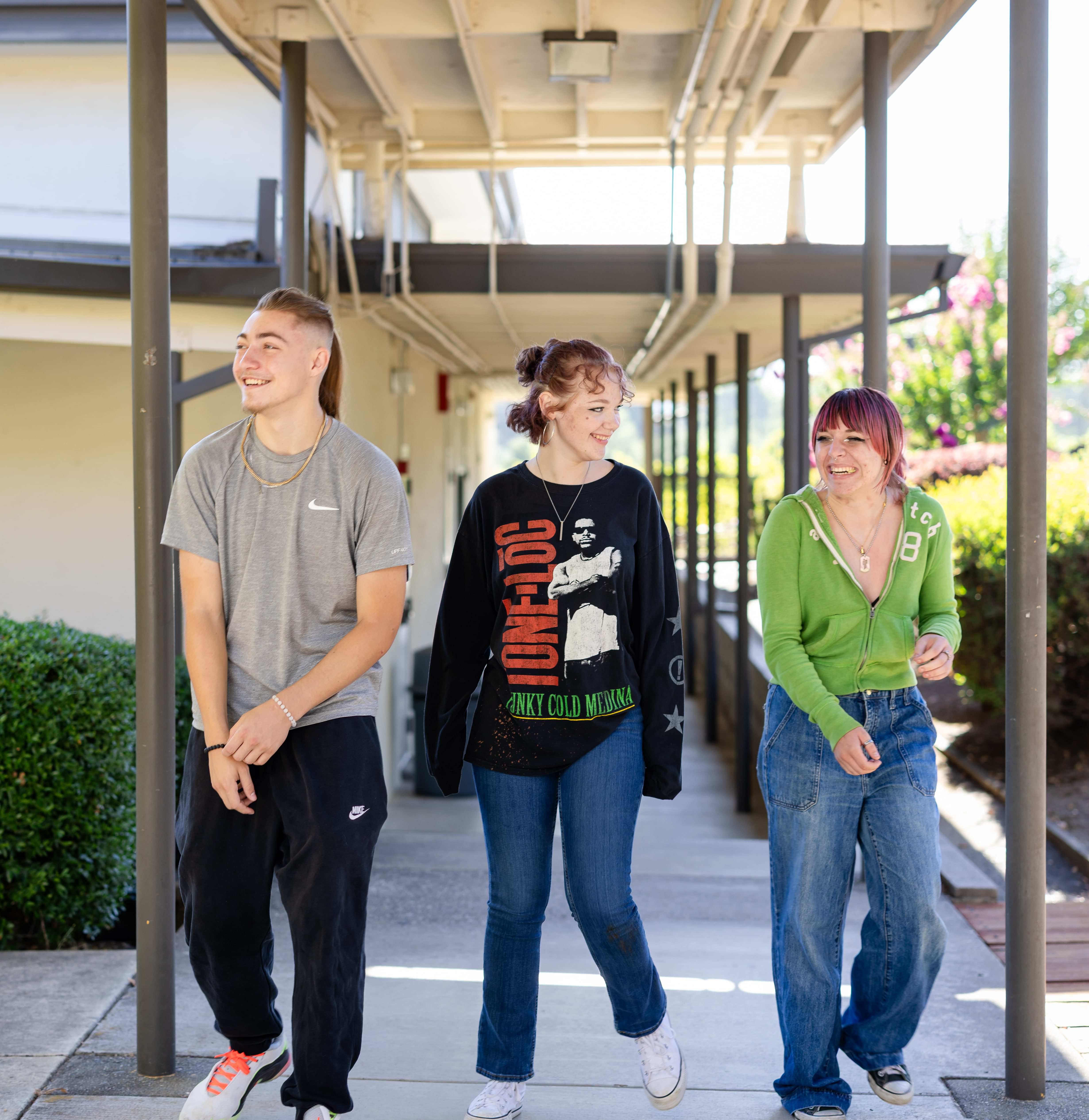 Three Hanna Center students walking together on campus.
