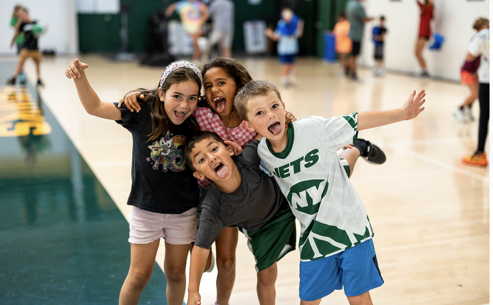 Children smile and pose together during a Hanna Recreation summer camp activity at Hanna Center.