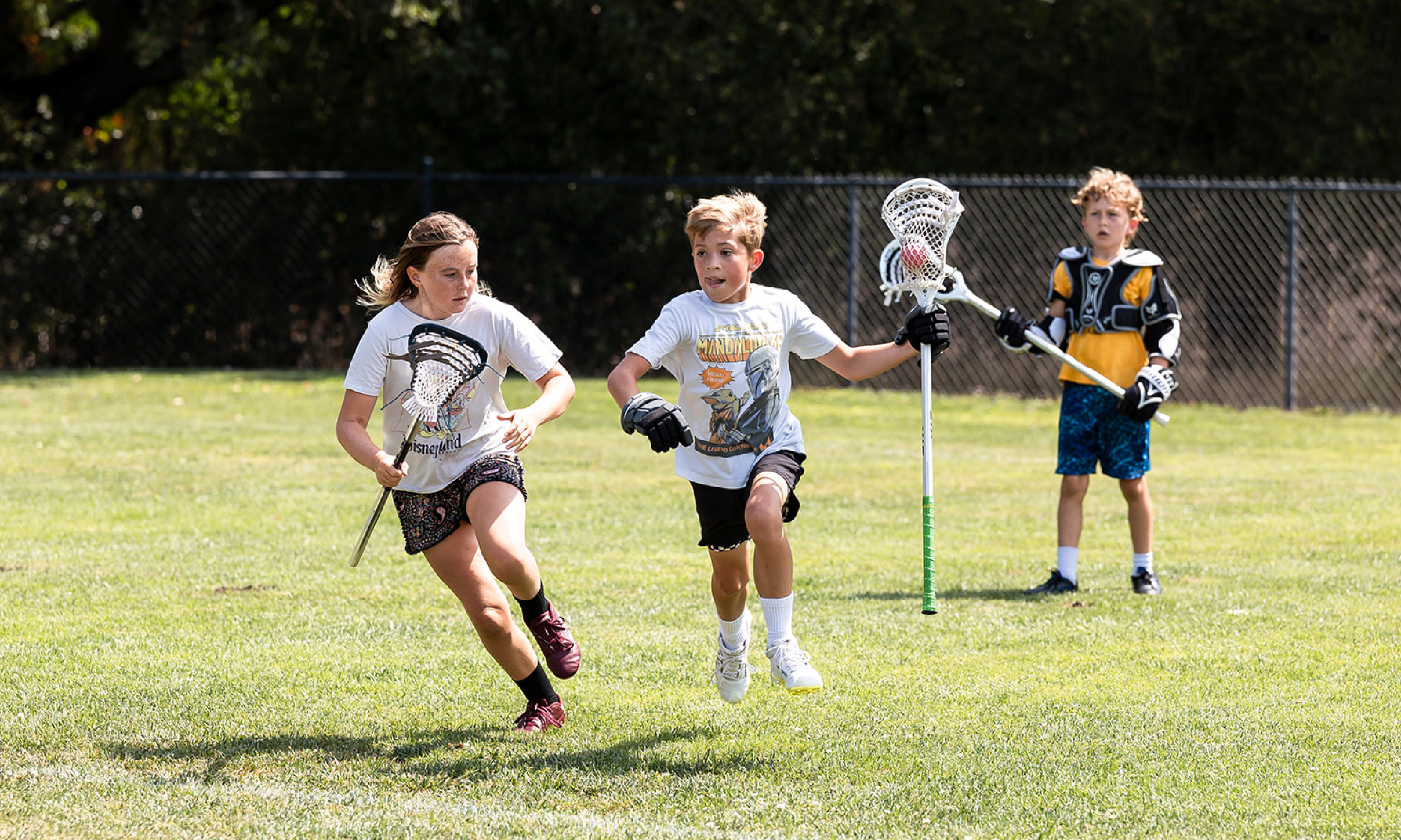 Child playing lacrosse at Hanna Center Camps.