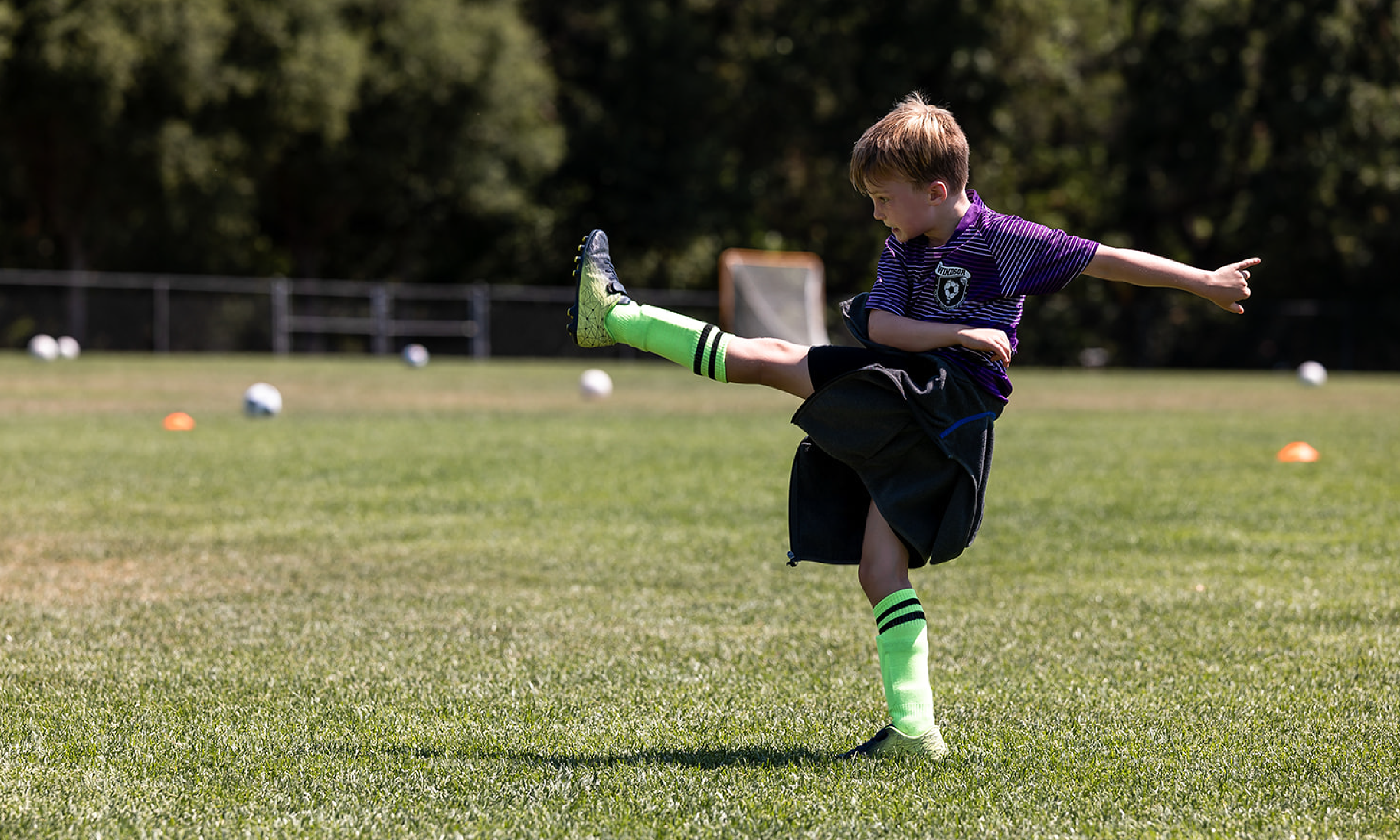 Child playing soccer at Hanna Center Camps.