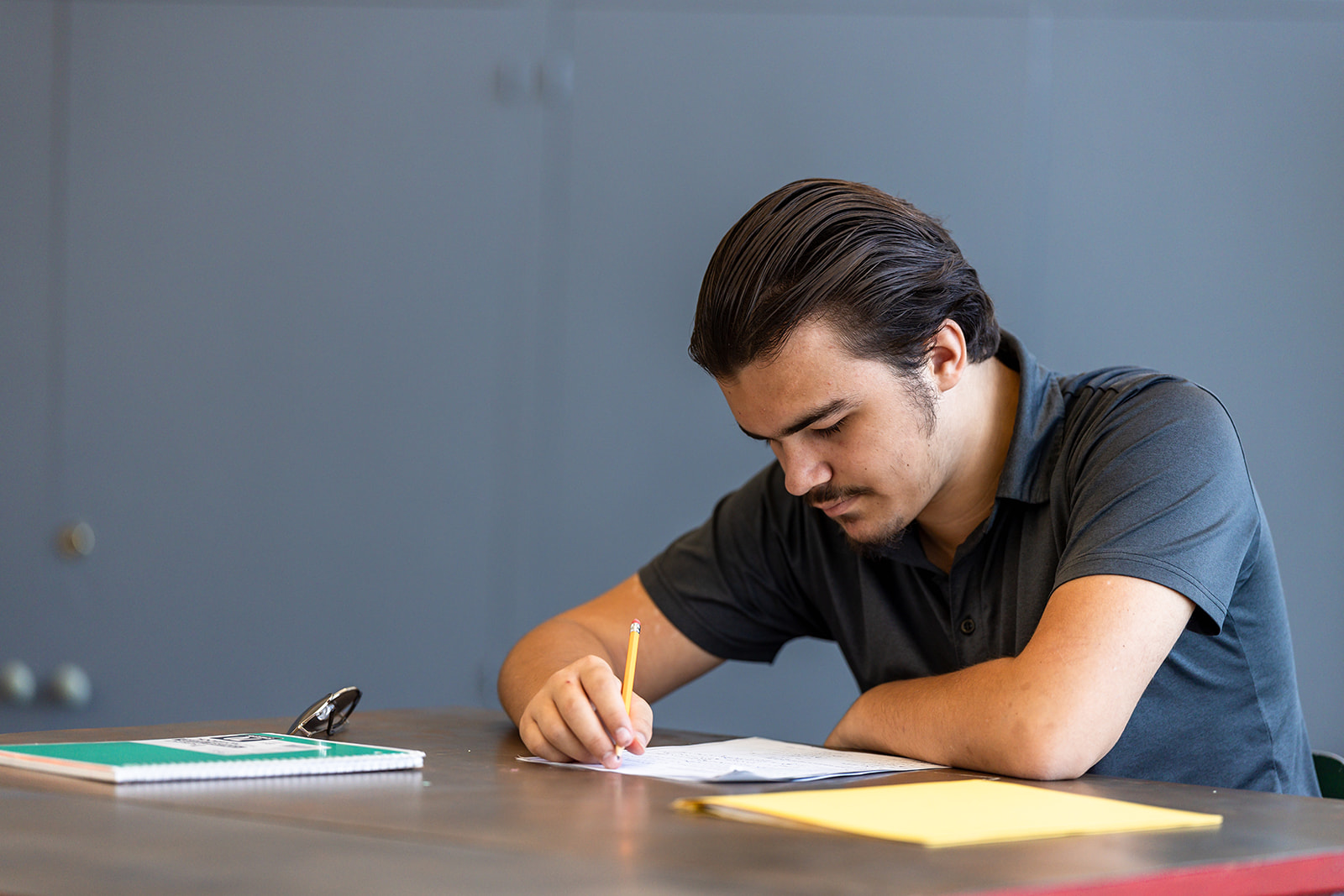Student writing an assignment.