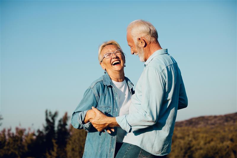 Senior couple smiling.