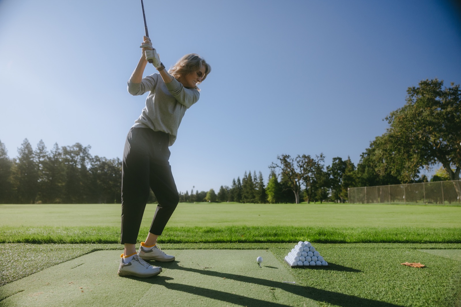 Golfer taking a swing at the Hanna Center Golf Classic at Sonoma Golf Club.
